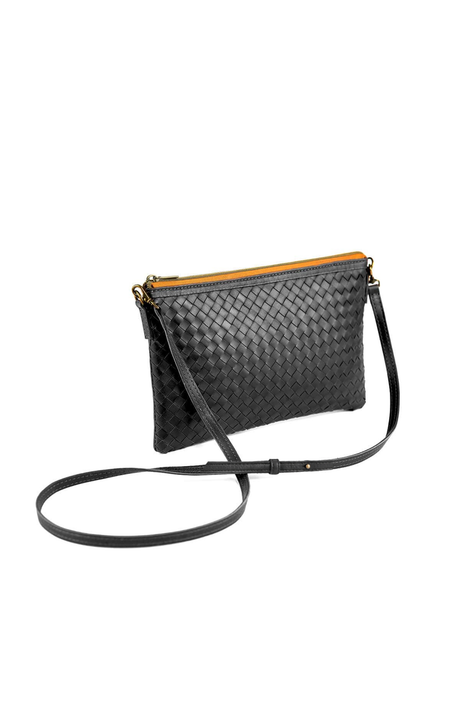 Black woven handbag with a strap on a white background