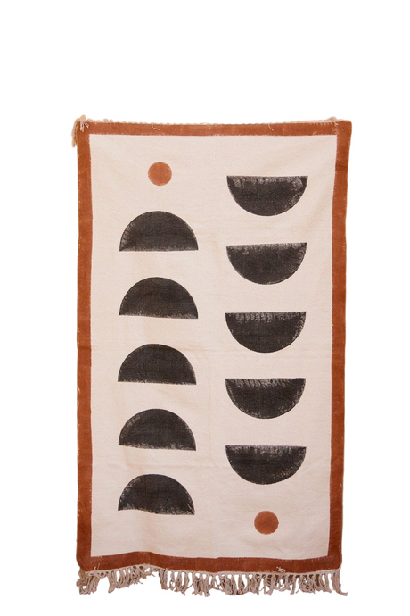 Rug with geometric pattern and fringes on a white background