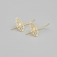 Gold flower-shaped earrings on a gray background