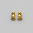 Pair of gold earrings on a gray background