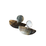 Pair of earrings with natural stone-like design on a white background