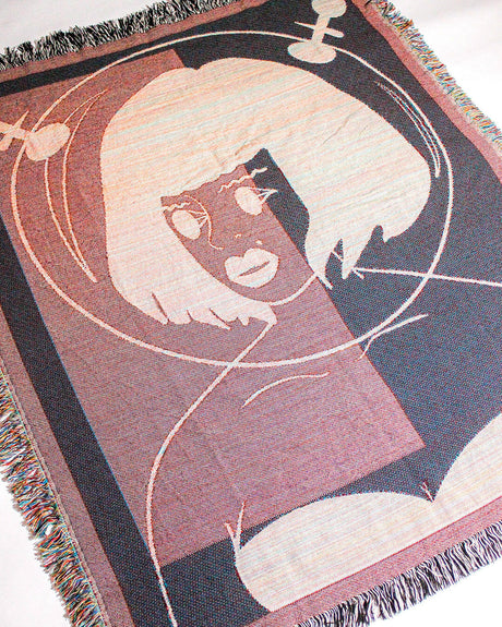 Galactic Muse Alien Cotton Woven Throw Blanket showcasing an alien art design in green, tan, and black.