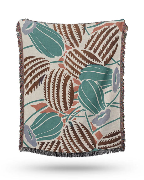 Southwestern-style throw blanket featuring hand-drawn desert plants and a textured finish.
