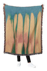 Cotton woven throw blanket featuring a modern heat map-inspired pattern in warm and cool tones.
