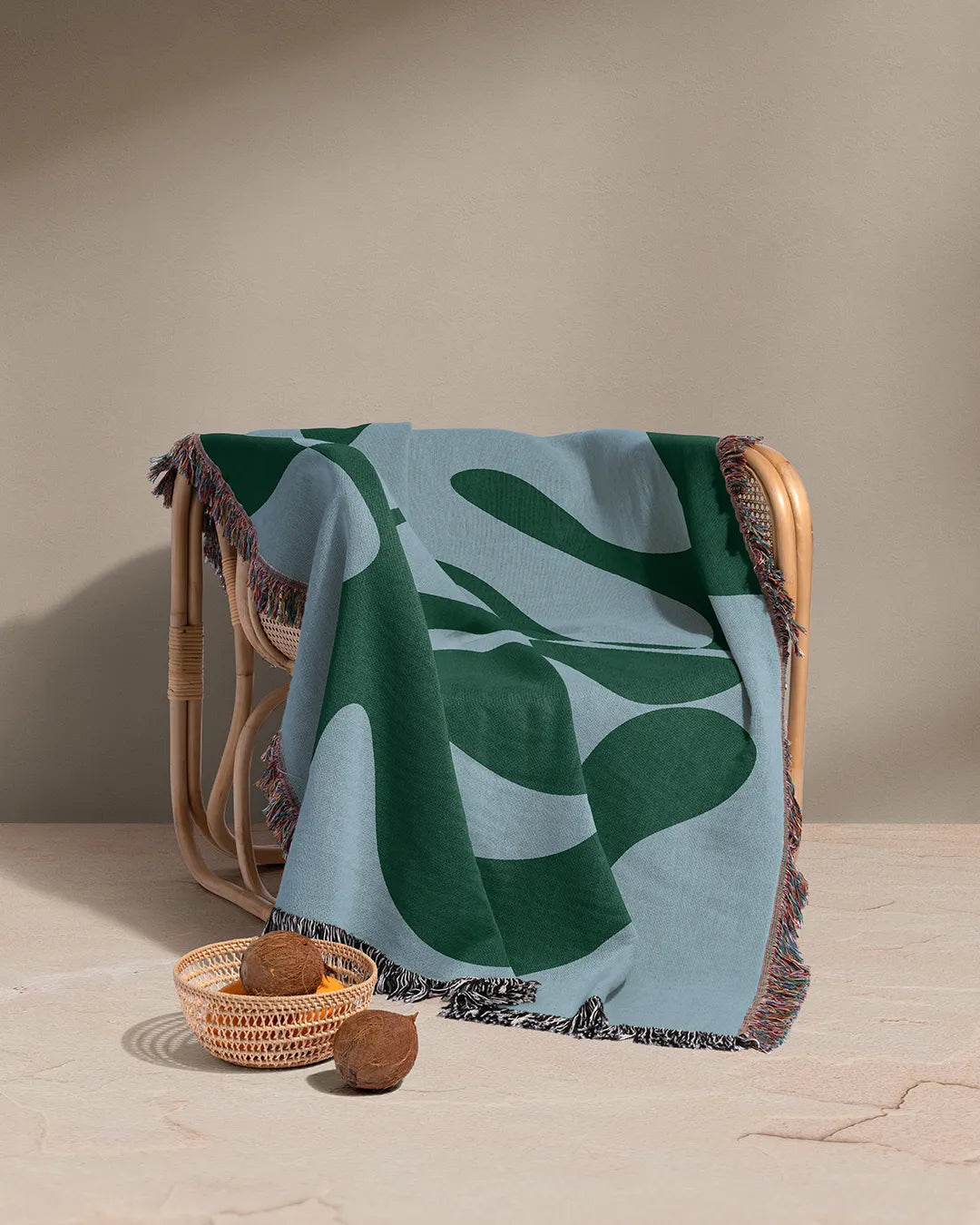 Abstract woven throw blanket featuring fluid shapes and a bold two-tone design.

