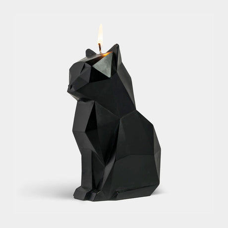 Black cat-shaped candle on a white background