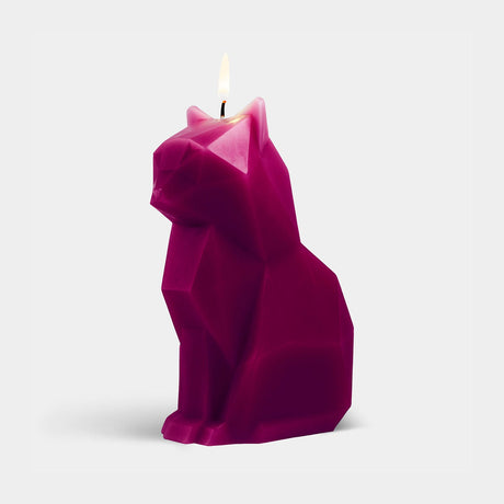 Pink cat-shaped candle on a white background