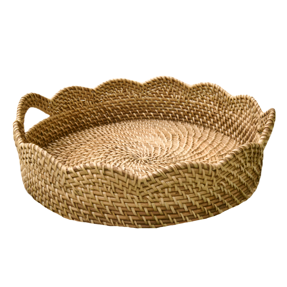 Woven basket with scalloped edge and handles on a white background