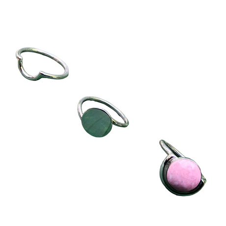 Three unique rings with different designs on a white background