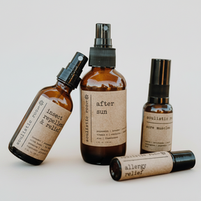Collection of natural remedy bottles with labels on a white background