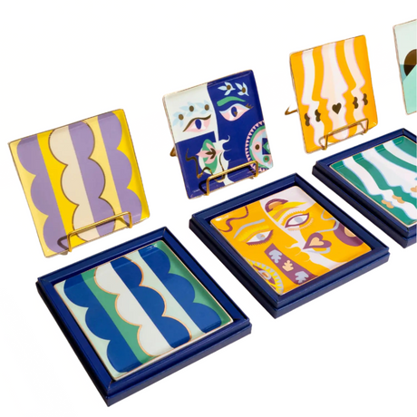 Set of colorful trays with abstract designs on a white background