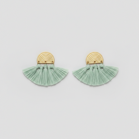 Pair of green tassel earrings with gold accents on a light gray background
