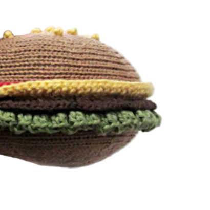 Crocheted hamburger-shaped toy on a white background