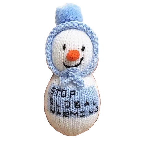 Knitted snowman toy with a blue hat and orange carrot nose, held in a hand.