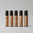 Five roller bottles with different labels on a white background