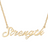 Gold necklace with 'Strength' pendant on a white background