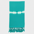 Teal towel with white tie-dye pattern and fringes on a light gray background