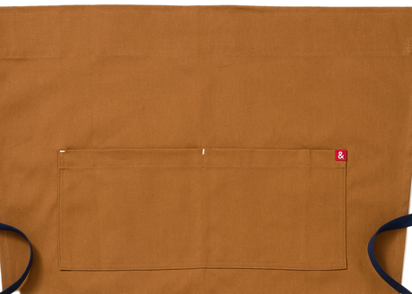 Brown apron with navy straps on a white background