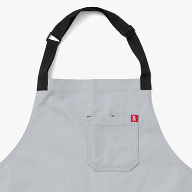 Gray apron with a red and white logo on a white background