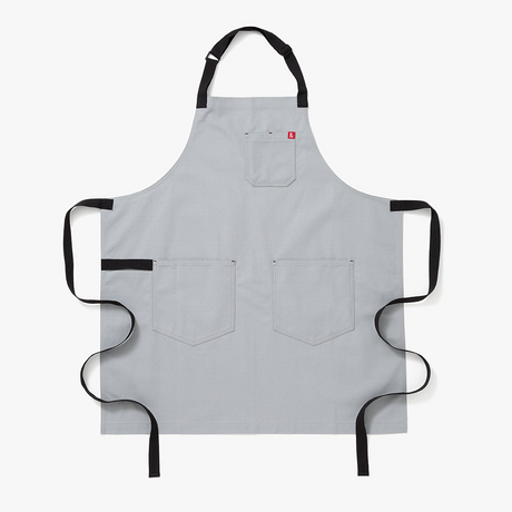 Gray apron with black straps on a white background