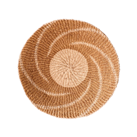 Round woven placemat with concentric circle pattern on a white background