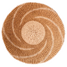 Round woven placemat with concentric circle pattern on a white background