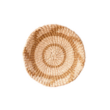 Round woven basket on a white background