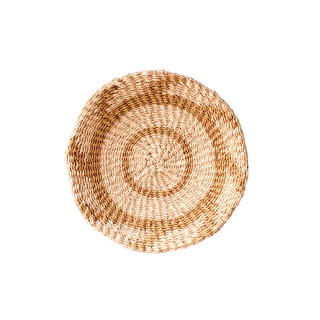Round woven basket on a white background