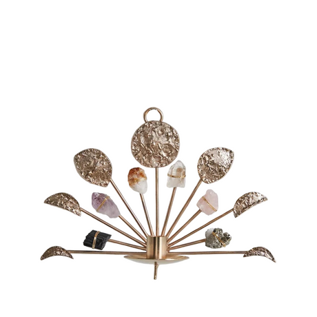 Decorative wall sconce with crystal stones on a white background