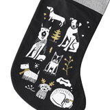 Black stocking with white and gold animal illustrations on a white background