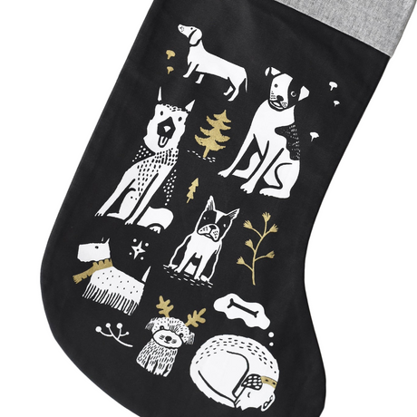 Black stocking with white and gold animal illustrations on a white background