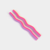 Set of colorful straws on a light gray background