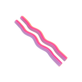 Two pink and purple candles on a white background