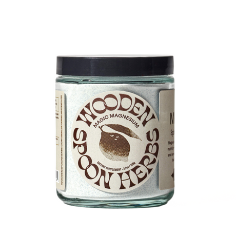 Glass jar with a label for 'Wooden Spoon Herbs' on a white background