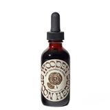 Bottle of Wooden Herbs on a white background